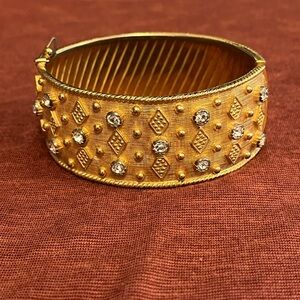 Signed wide retro gold metal bracelet